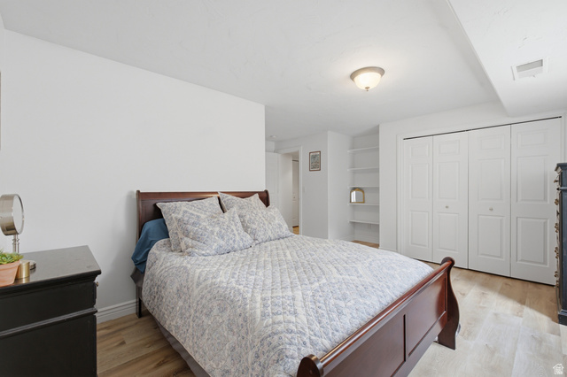 11811 Cottage View Lane Draper, UT 84020 - Photo 13 of 25 Bedroom featuring wood-finish flooring, recessed lighting, and a built-in shelving unit