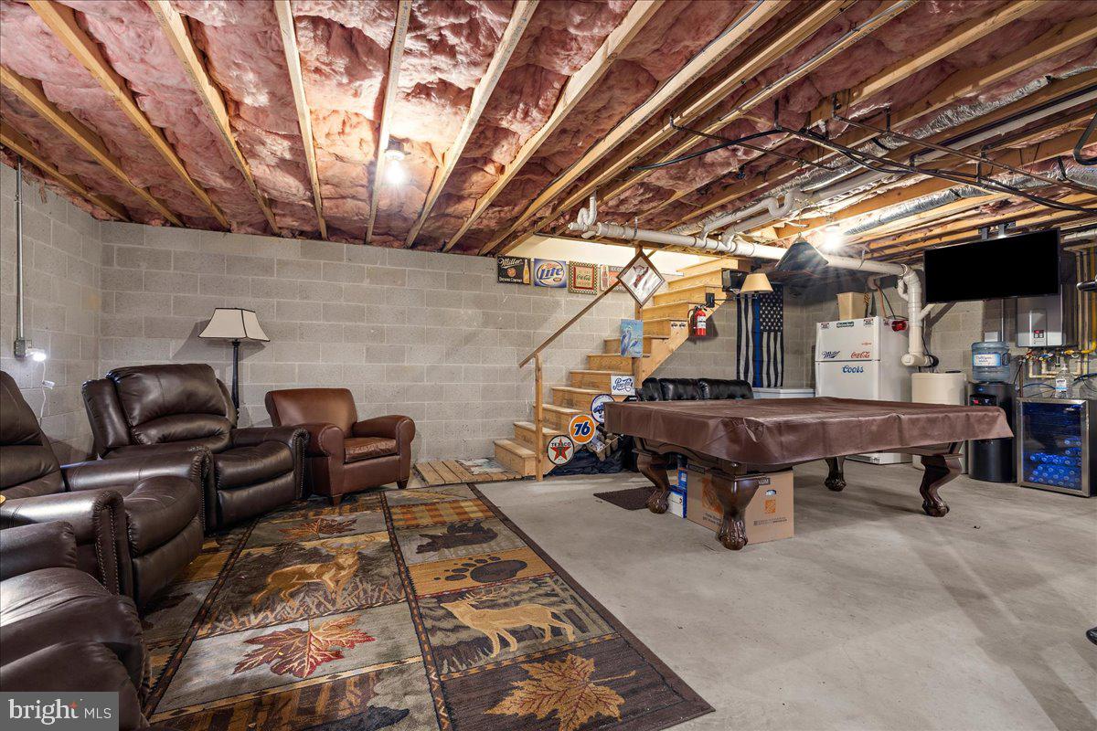 12440 Woods Road Worton, MD 21678 - Photo 26 of 37 a living room with furniture and a wooden floor