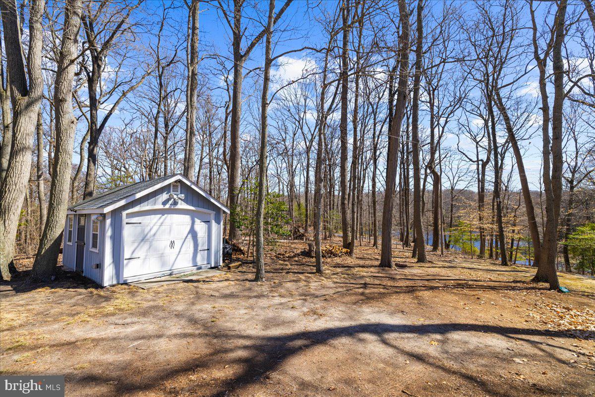 12440 Woods Road Worton, MD 21678 - Photo 27 of 37 a view of a house with a snow on the road