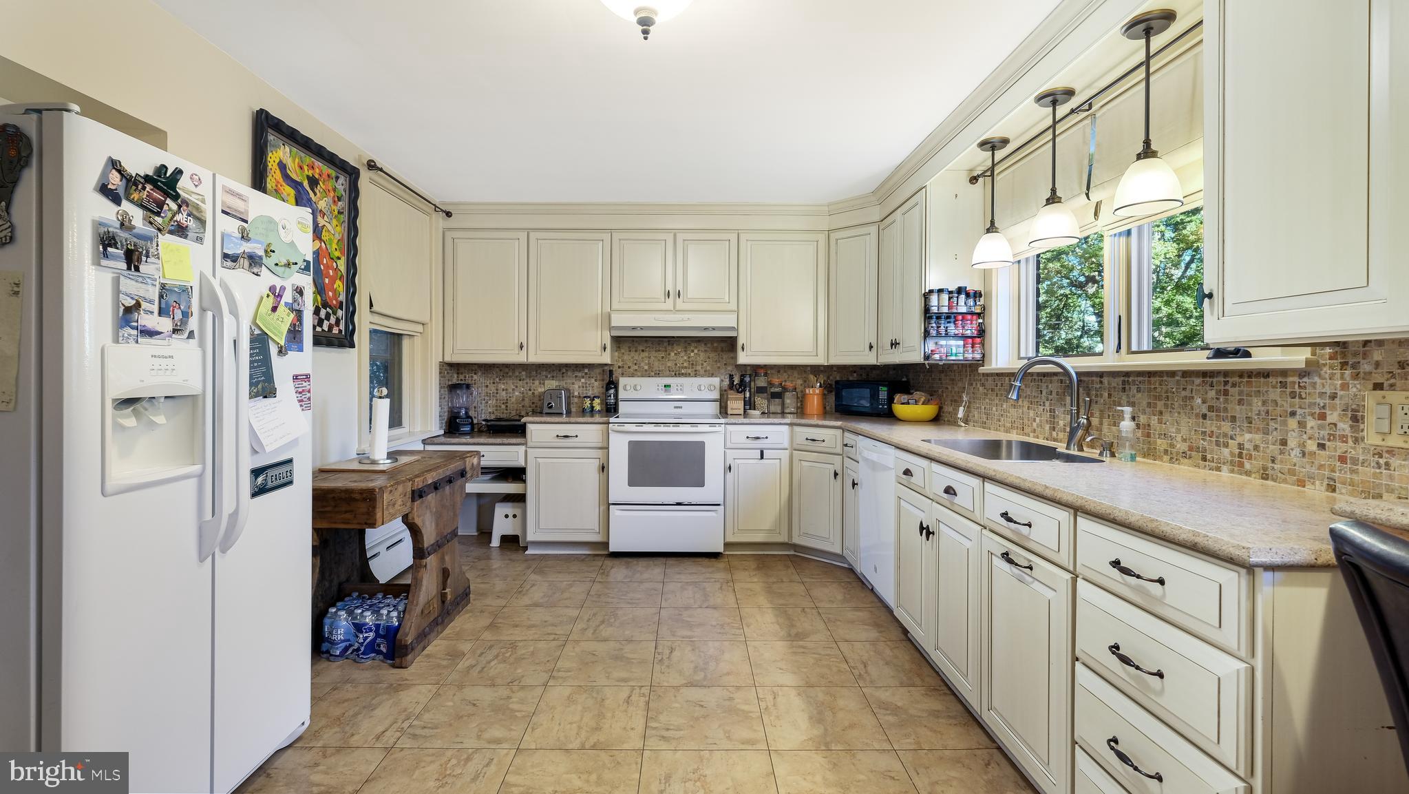 137 South Main Street Dublin, PA 18917 - Photo 11 of 29 a kitchen with stainless steel appliances a refrigerator sink and cabinets
