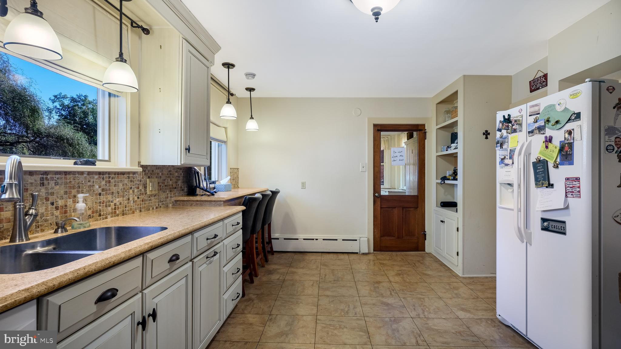 137 South Main Street Dublin, PA 18917 - Photo 12 of 29 a kitchen with stainless steel appliances a sink and a refrigerator