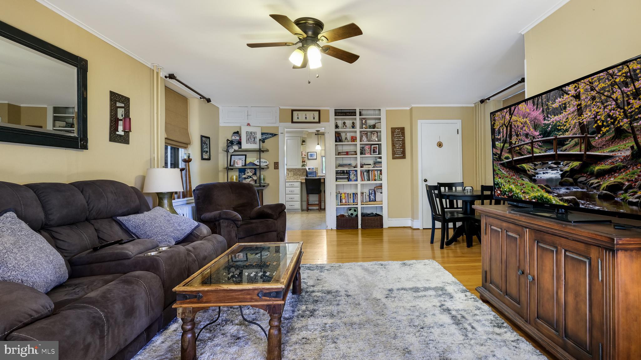 137 South Main Street Dublin, PA 18917 - Photo 16 of 29 a living room with furniture a rug and a flat screen tv