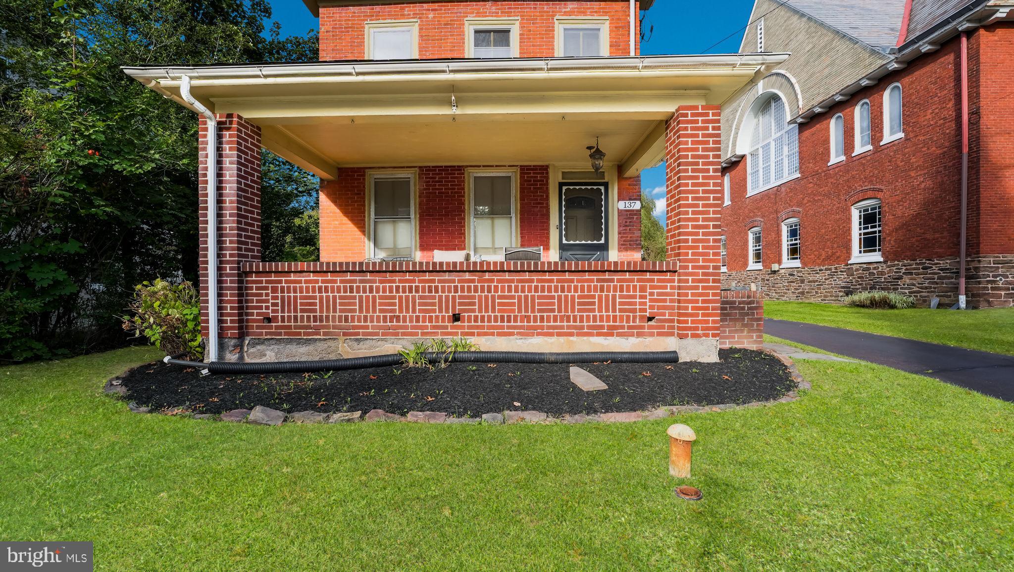 137 South Main Street Dublin, PA 18917 - Photo 2 of 29 a front view of a house with a yard