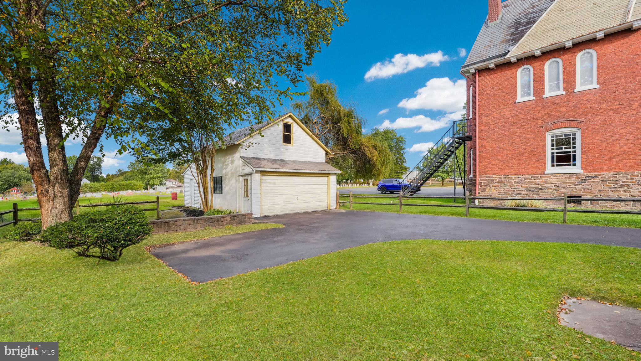 137 South Main Street Dublin, PA 18917 - Photo 27 of 29 a front view of a house with a yard and garage
