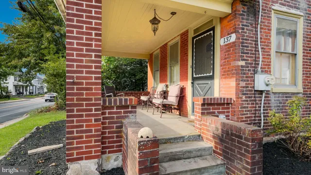 a front view of a building with garden