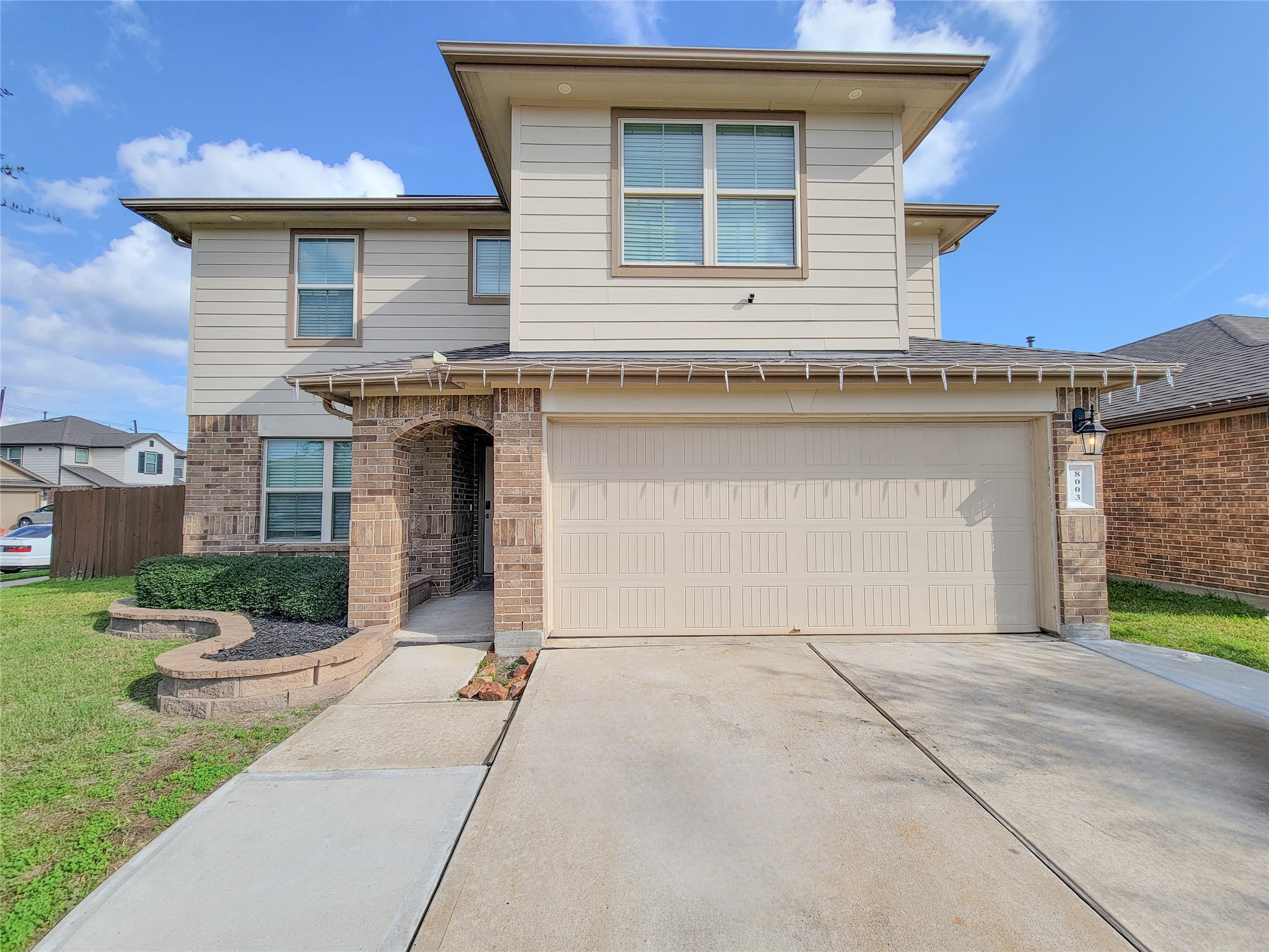 8003 Ecru Lane Rosharon, TX 77583 - Photo 4 of 43 a front view of a house with yard