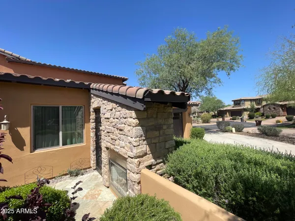 a view of a garden with an outdoor seating