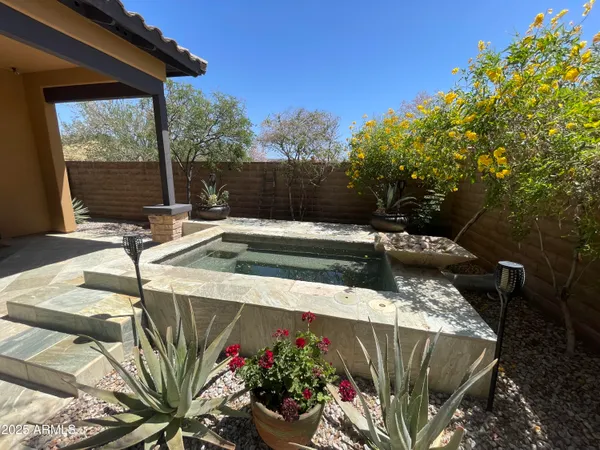 a view of a swimming pool with a patio