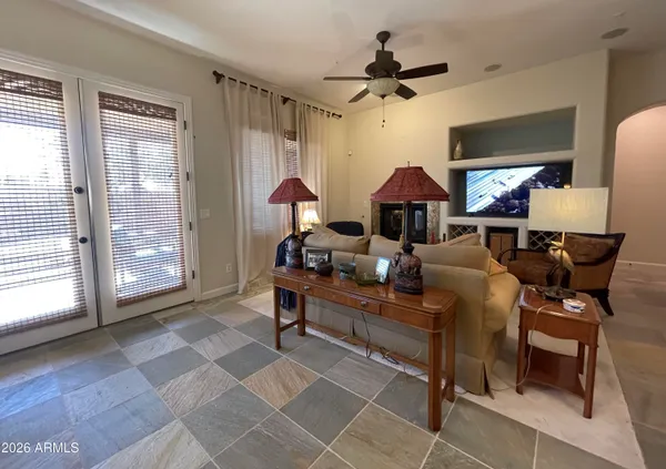 a living room with furniture and a large window