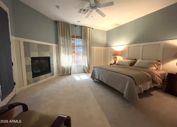 a bathroom with a granite countertop sink mirror and a bath tub