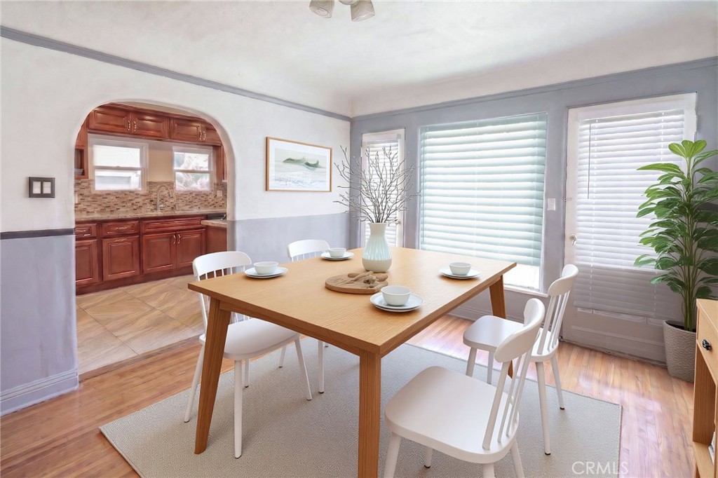 346 West School Street Compton, CA 90220 - Photo 12 of 29 a view of a dining room with furniture window and wooden floor