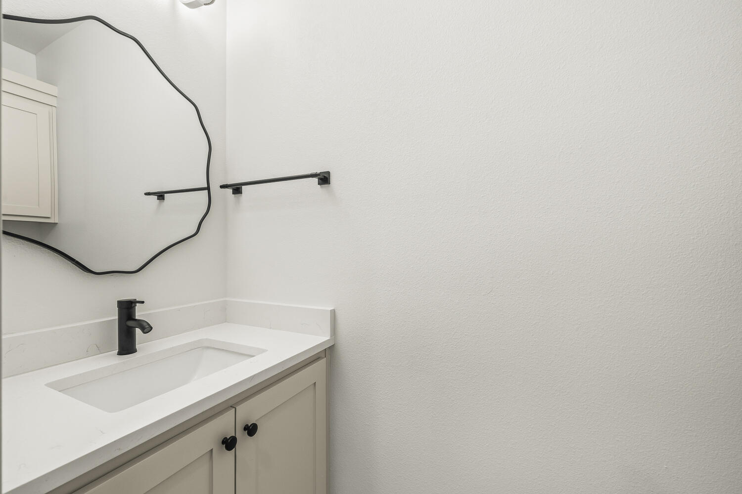 5603 County Road 6100 Lubbock, TX 79415 - Photo 17 of 46 a bathroom with a sink and vanity