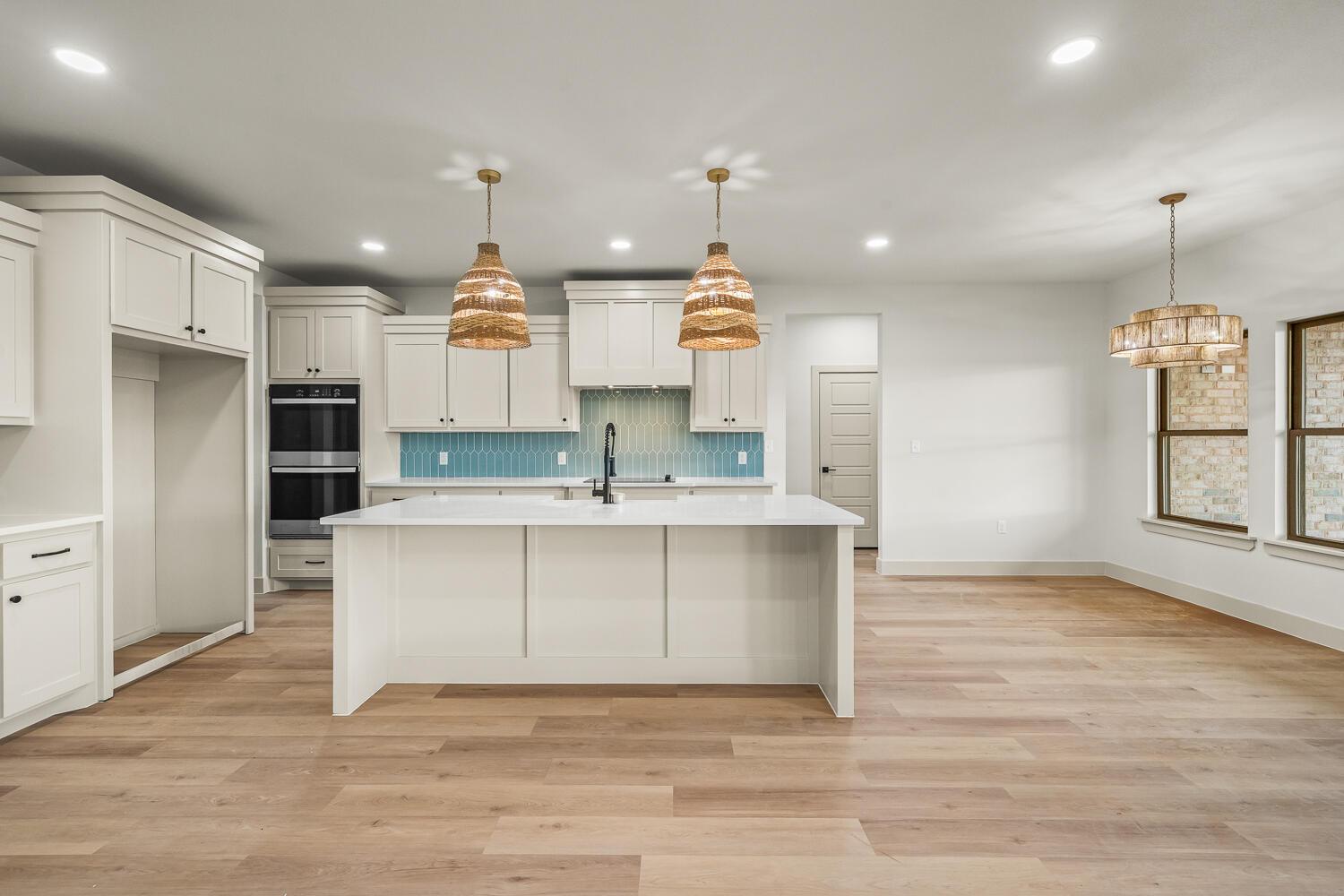 5603 County Road 6100 Lubbock, TX 79415 - Photo 34 of 46 a large kitchen with kitchen island a sink stainless steel appliances and cabinets
