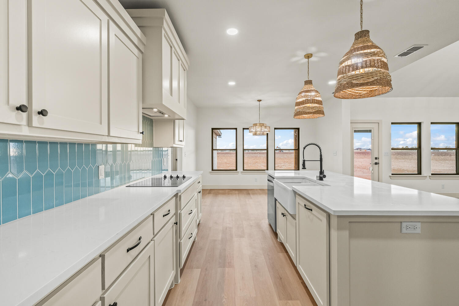 5603 County Road 6100 Lubbock, TX 79415 - Photo 37 of 46 a kitchen with counter top space and a sink
