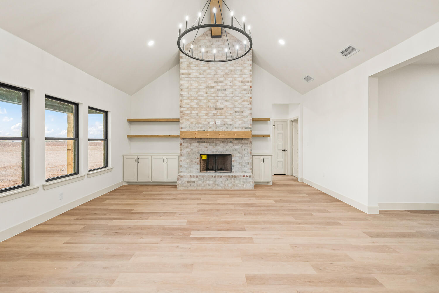 5603 County Road 6100 Lubbock, TX 79415 - Photo 38 of 46 a view of an empty room with window and wooden floor