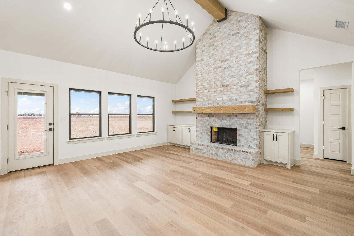 5603 County Road 6100 Lubbock, TX 79415 - Photo 39 of 46 a view of an empty room with a fireplace and a window