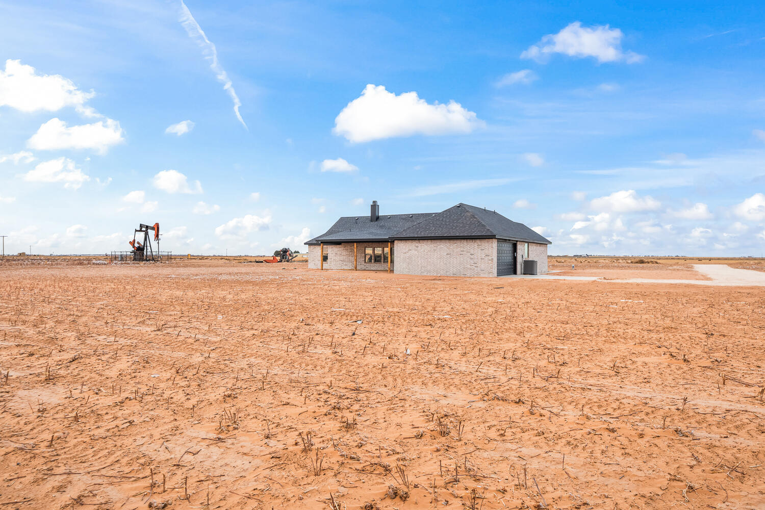 5603 County Road 6100 Lubbock, TX 79415 - Photo 44 of 46 a view of a house with a yard