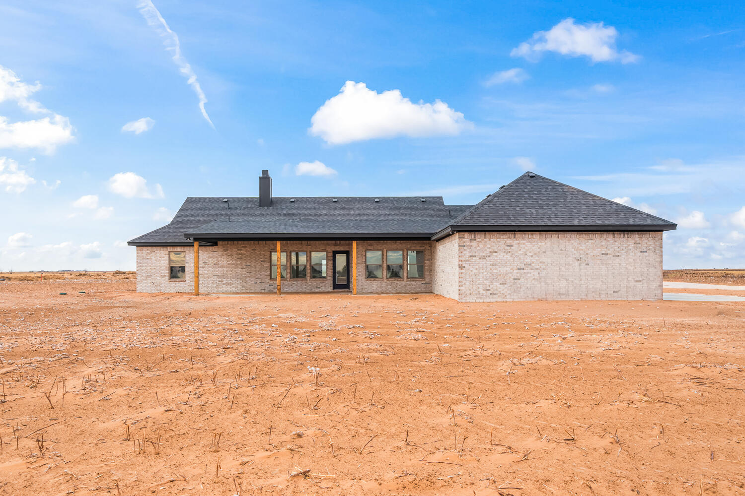 5603 County Road 6100 Lubbock, TX 79415 - Photo 45 of 46 a front view of house with yard and trees in the background