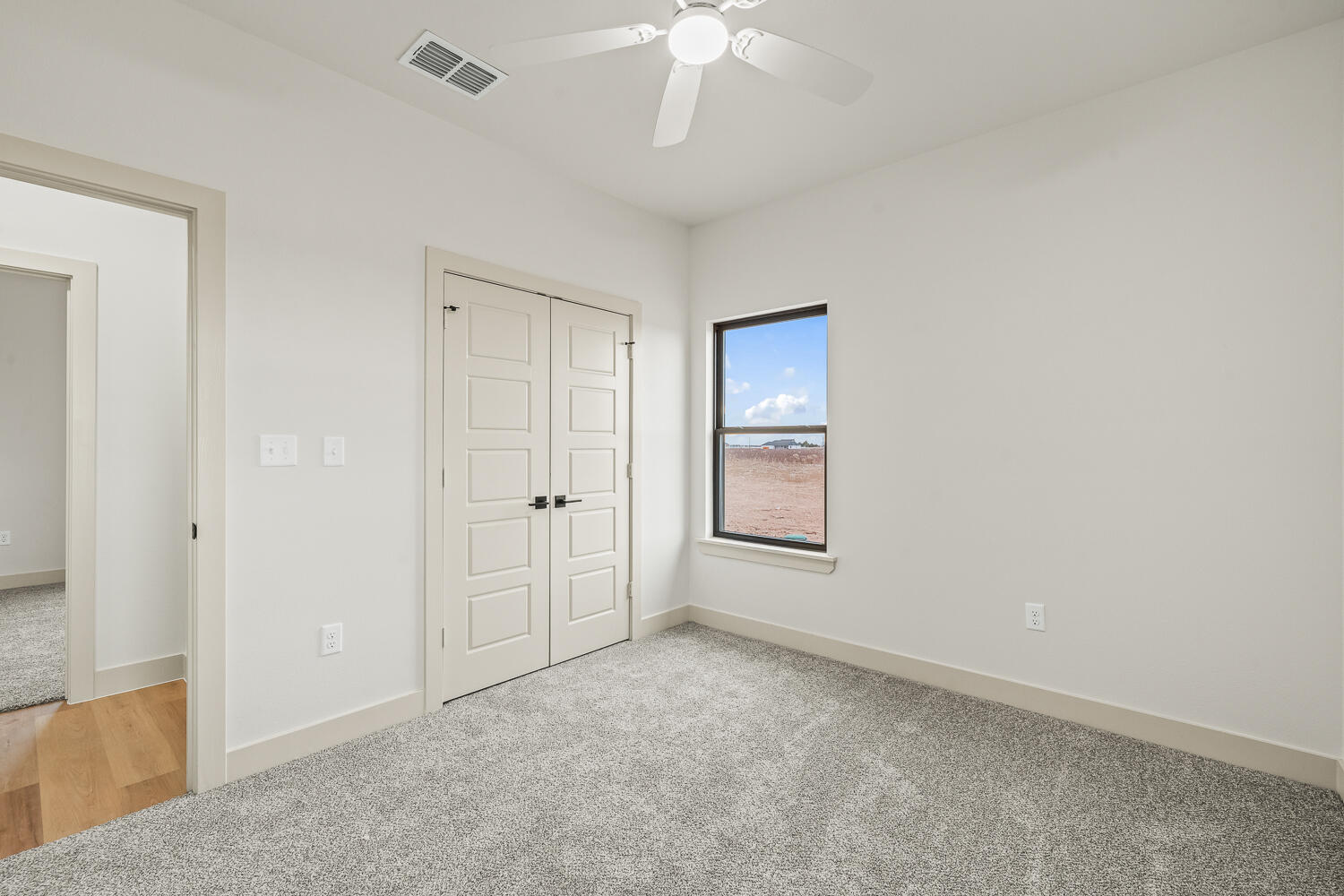 5603 County Road 6100 Lubbock, TX 79415 - Photo 8 of 46 a view of an empty room with a window