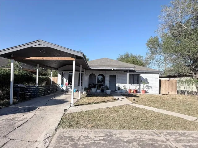 a view of a house with backyard porch and sitting area
