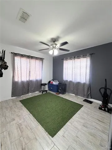 a living room with a bed furniture and a window