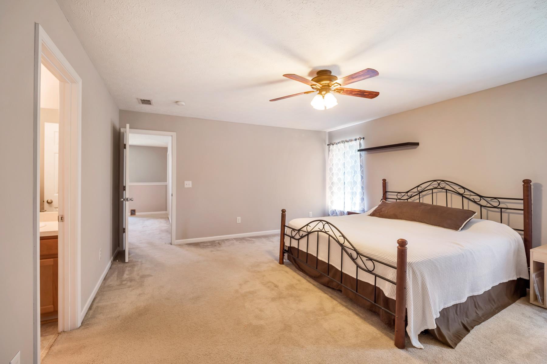 3977 Stephens Ridge Way Antioch, TN 37013 - Photo 12 of 23 a bedroom with a bed and a chandelier