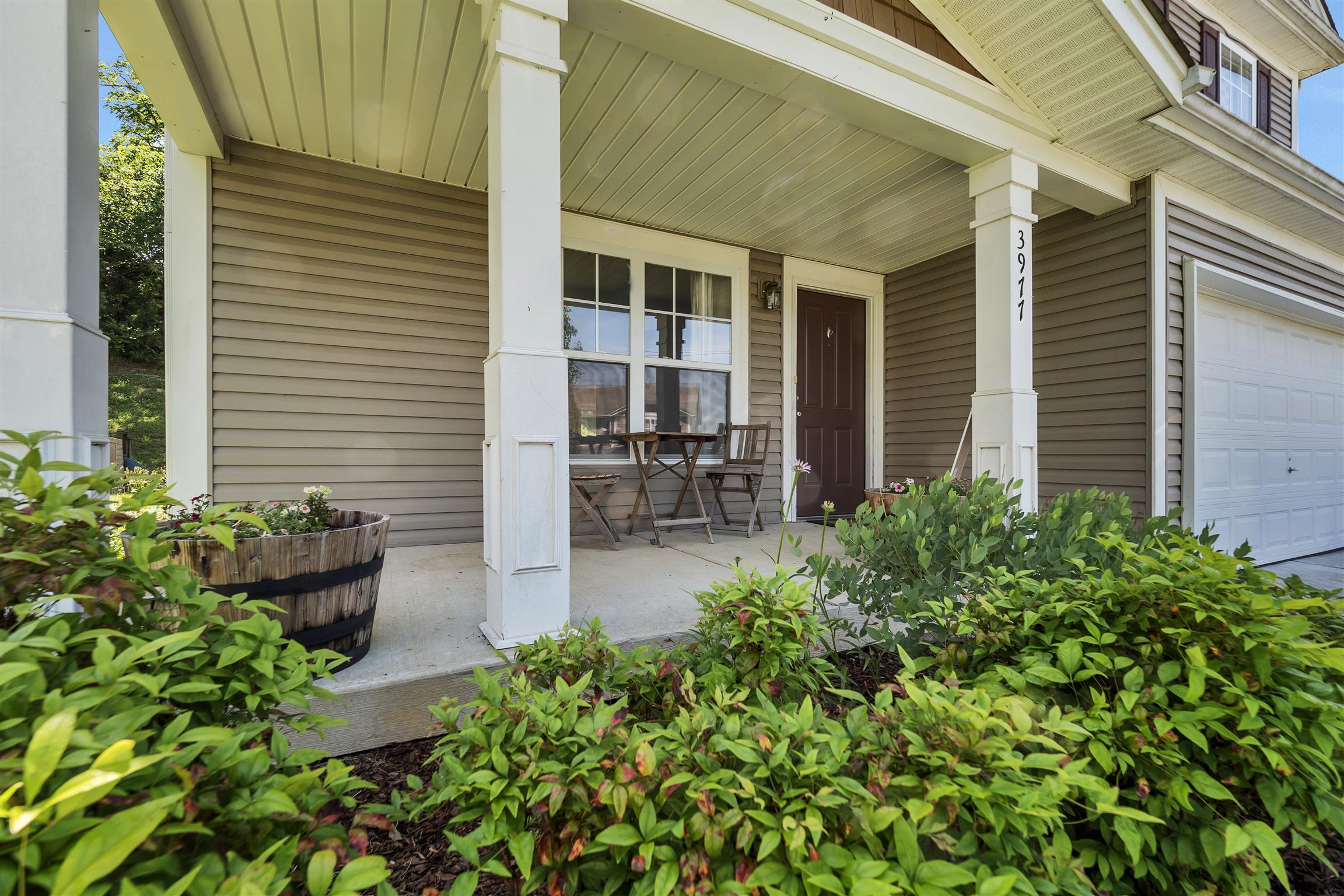 3977 Stephens Ridge Way Antioch, TN 37013 - Photo 2 of 23 front view of a house with potted plants