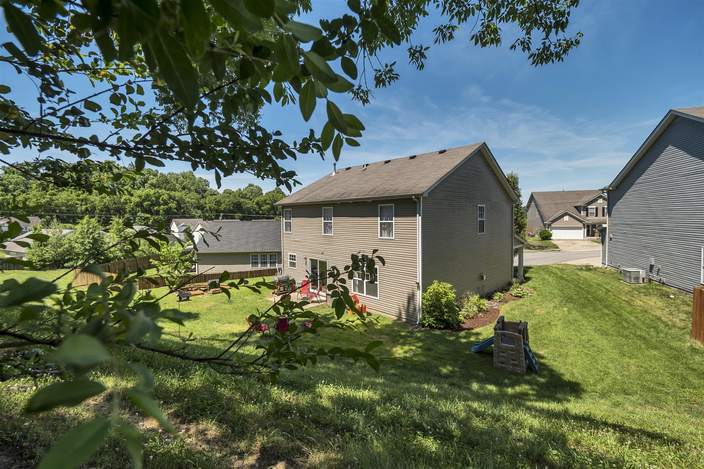 3977 Stephens Ridge Way Antioch, TN 37013 - Photo 4 of 23 a front view of a house with garden