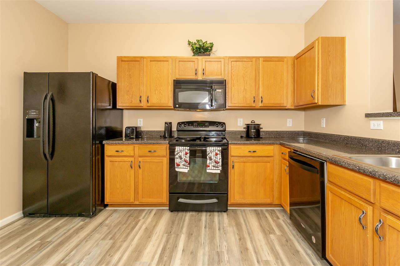 1640 Extine Lane Raleigh, NC 27610 - Photo 14 of 28 Dishwasher is new. Features vinyl tile flooring throughout. Kitchen