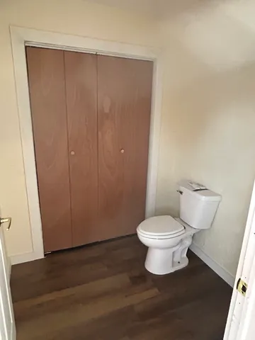 wooden floor in a hall with a mirror