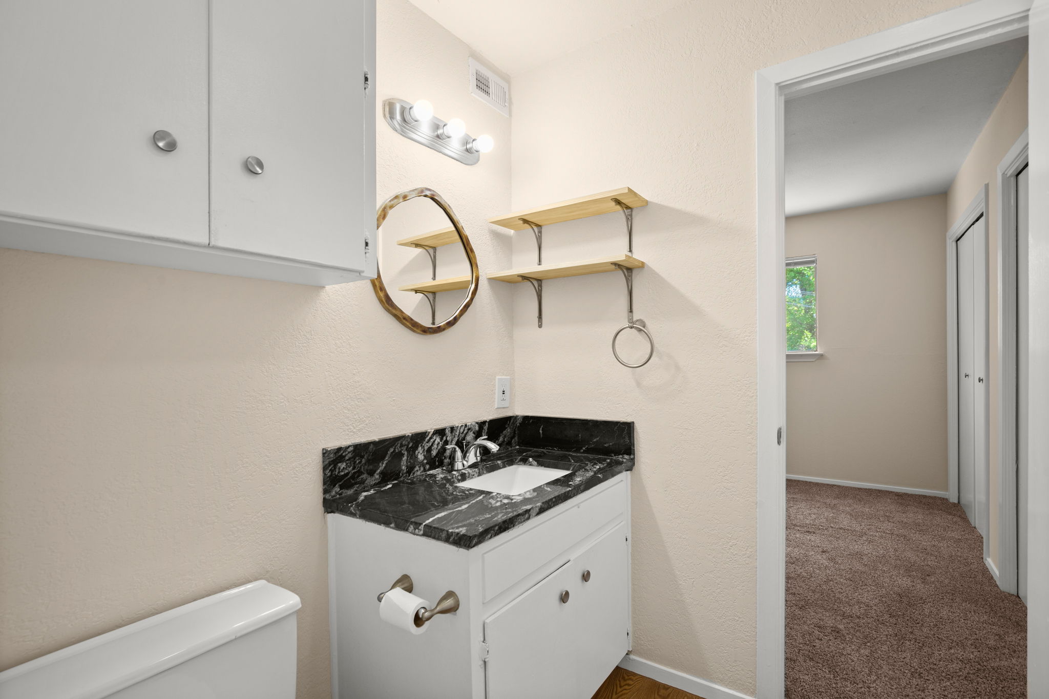 1912 Lightsey Road, Unit 2 Austin, TX 78704 - Photo 10 of 25 a bathroom with a sink and a mirror