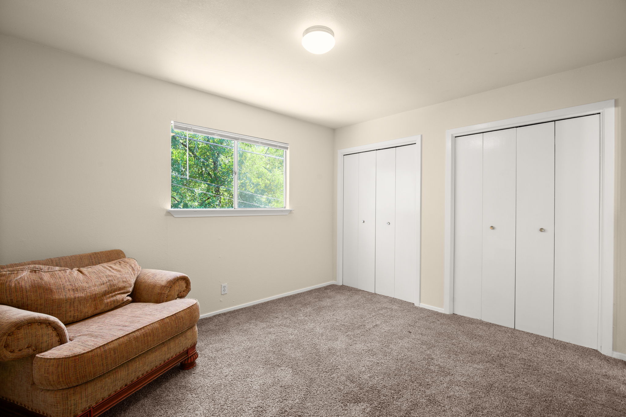 1912 Lightsey Road, Unit 2 Austin, TX 78704 - Photo 11 of 25 a living room with furniture and a window