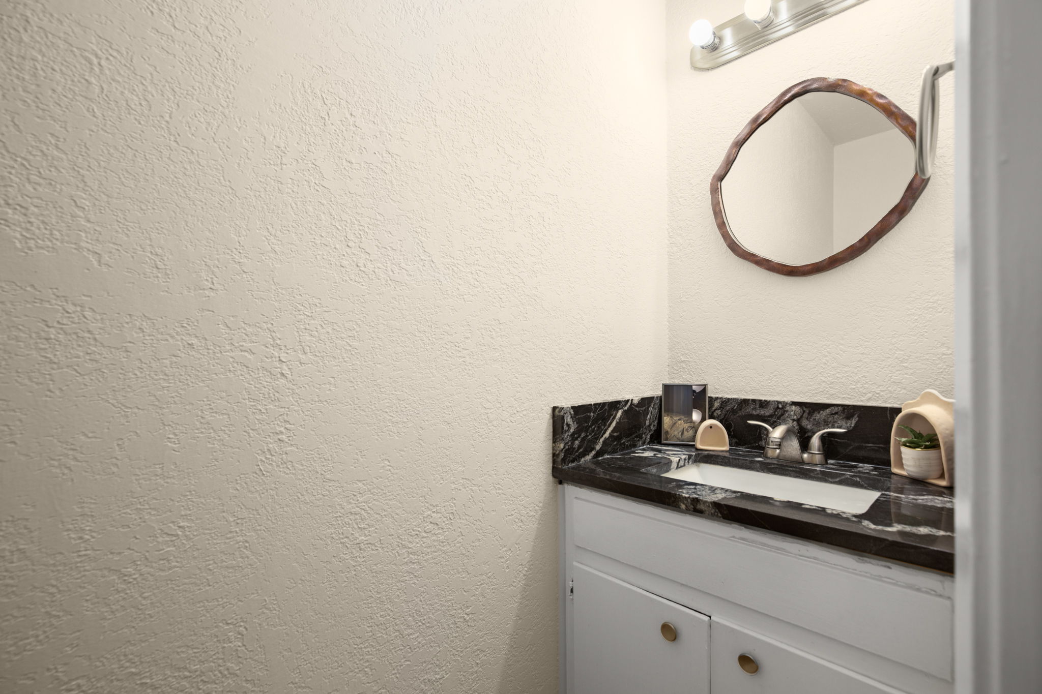 1912 Lightsey Road, Unit 2 Austin, TX 78704 - Photo 13 of 25 a bathroom with a sink and a mirror