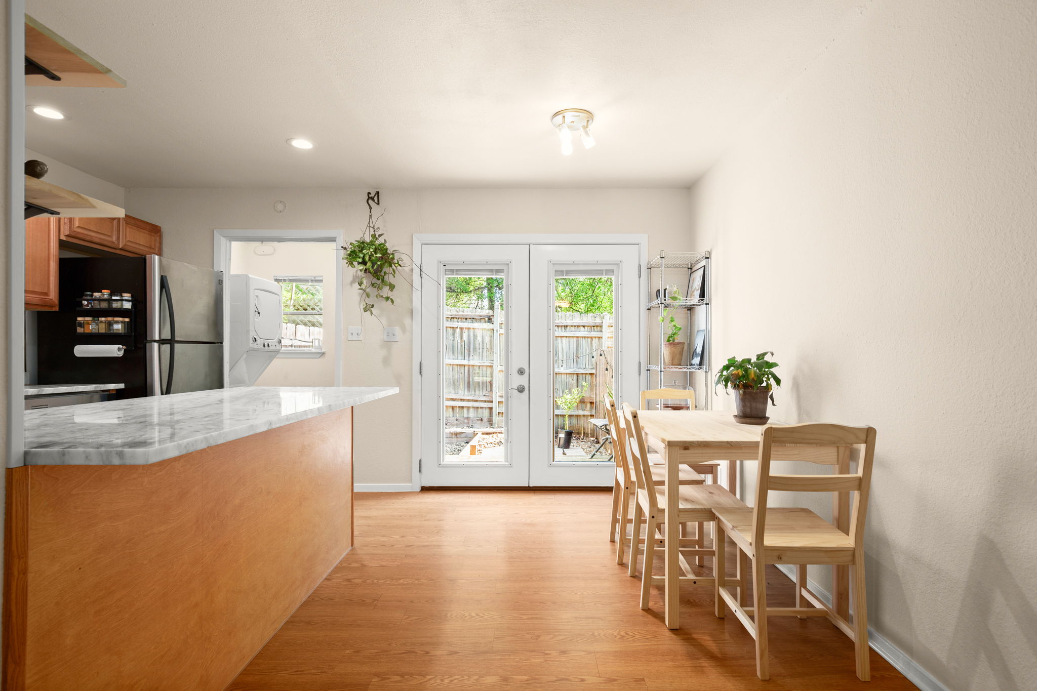a view of a dining room with furniture and a large window