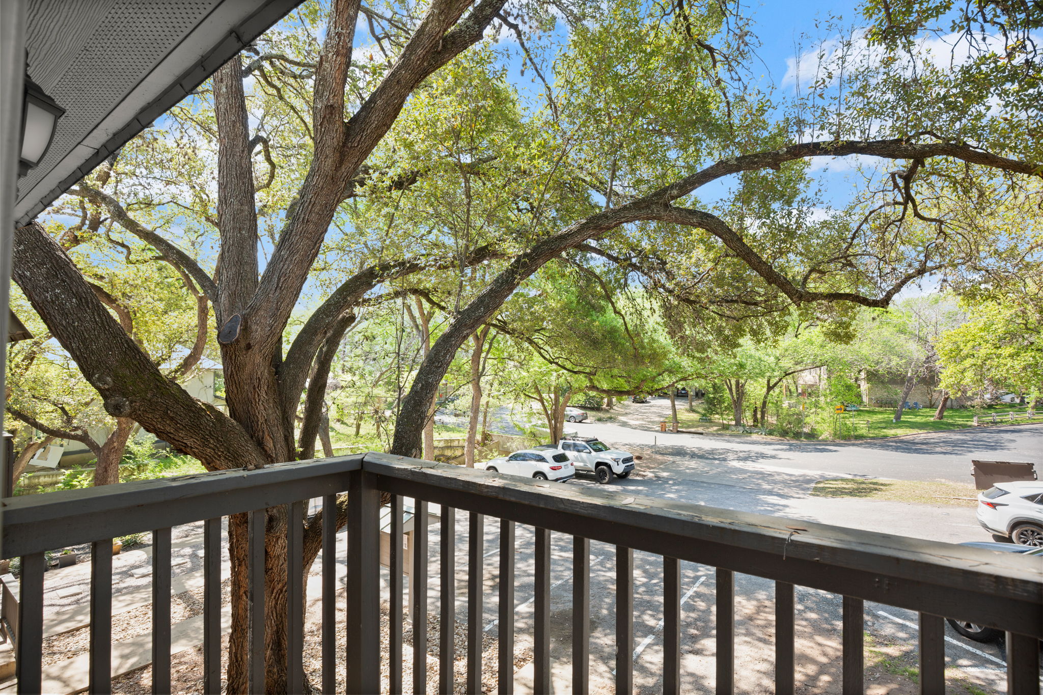 1912 Lightsey Road, Unit 2 Austin, TX 78704 - Photo 9 of 25 a view of trees and yard from a balcony