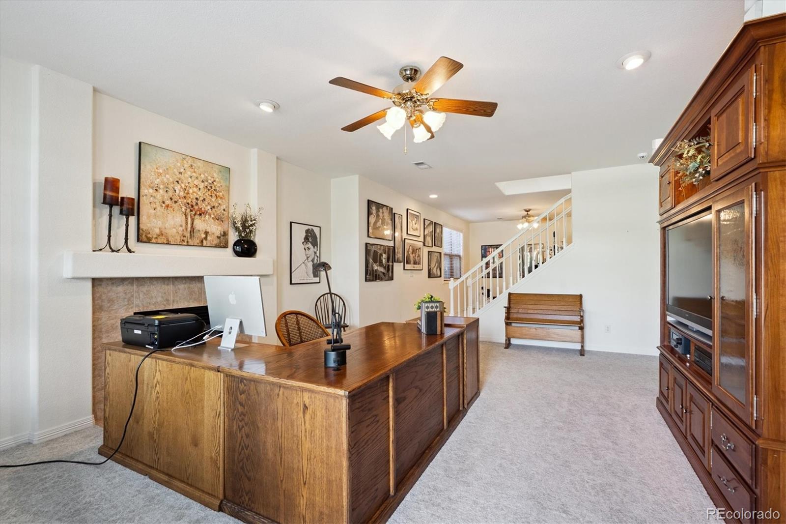 9851 Greensview Circle Lone Tree, CO 80124 - Photo 17 of 27 a living room with furniture a dining table and a fireplace