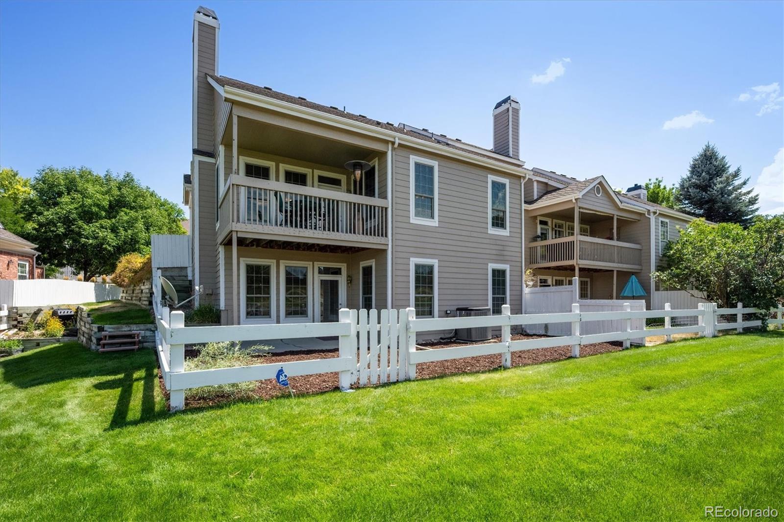 9851 Greensview Circle Lone Tree, CO 80124 - Photo 23 of 27 a front view of house with yard