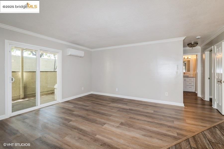 1505 Kirker Pass Road, Unit 170 Concord, CA 94521 - Photo 2 of 18 a view of an empty room with wooden floor and a window