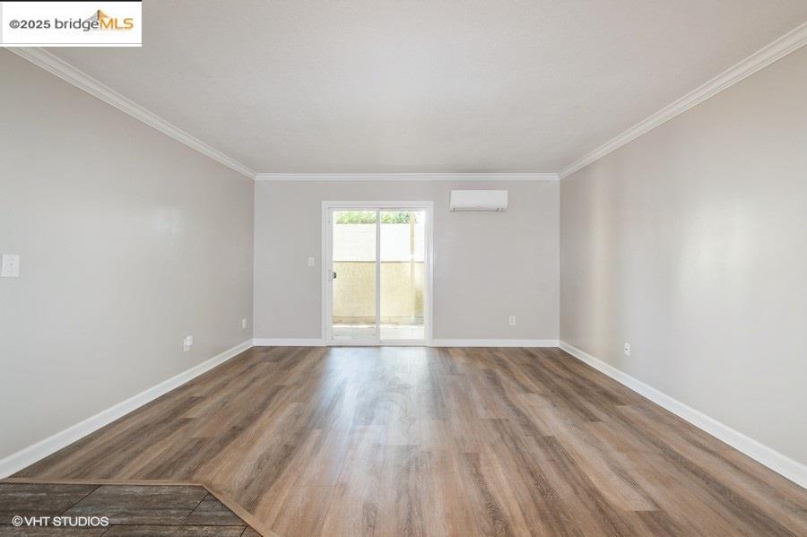 1505 Kirker Pass Road, Unit 170 Concord, CA 94521 - Photo 3 of 18 a view of an empty room with wooden floor and window
