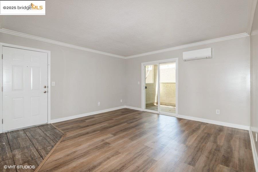 1505 Kirker Pass Road, Unit 170 Concord, CA 94521 - Photo 4 of 18 a view of an empty room with wooden floor and a window
