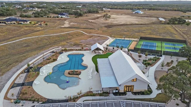 an aerial view of a house with outdoor space