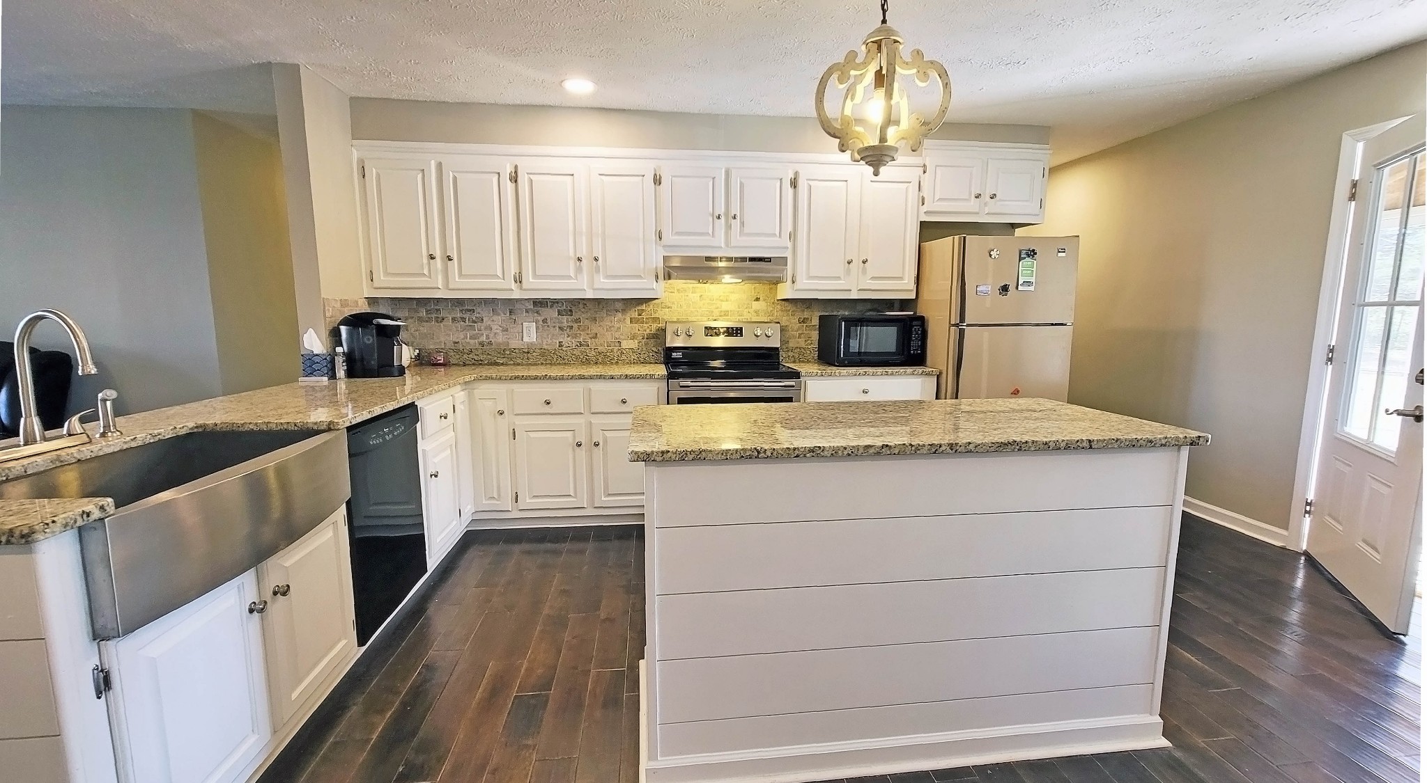 3149 Old Well Road Morrison, TN 37357 - Photo 8 of 43 a kitchen with stainless steel appliances granite countertop a sink stove refrigerator and cabinets
