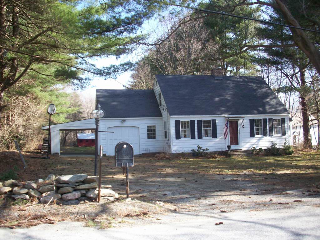 48 Mill Road Stamford, VT 05352 - Photo 1 of 11 a front view of a house with a yard