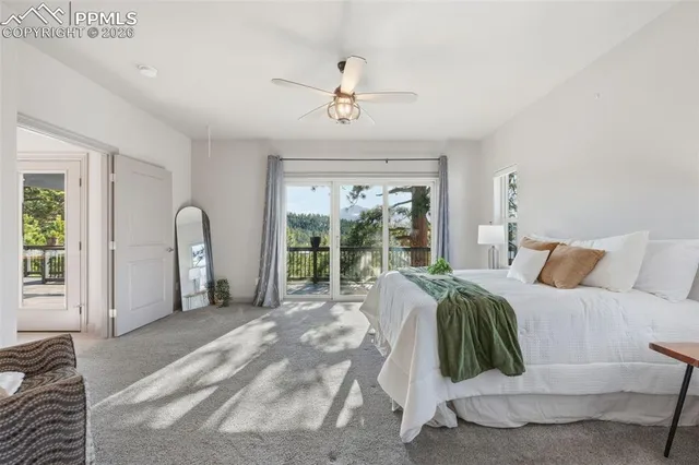 a spacious bedroom with a bed and a window