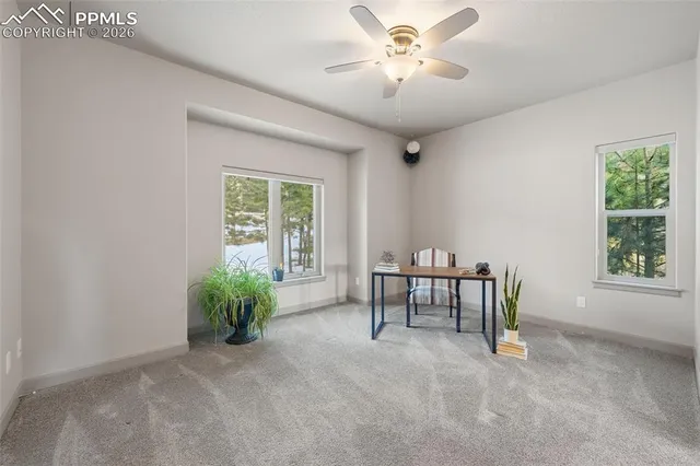 a view of workspace with furniture and window