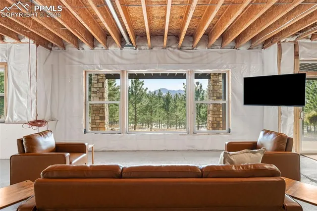 a view of a livingroom with furniture and windows