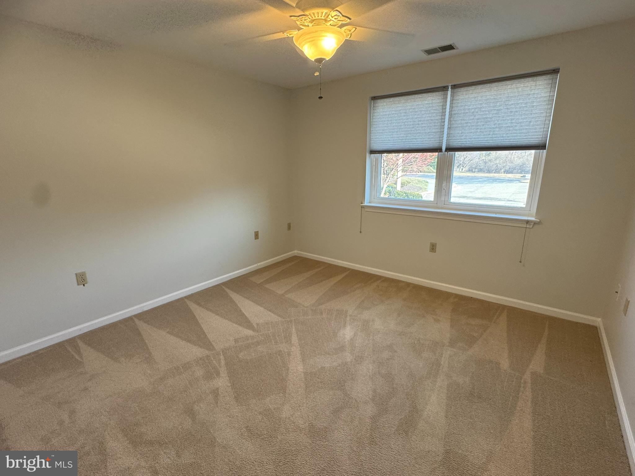 102 Mercer Court, Unit 21 3 Frederick, MD 21701 - Photo 11 of 31 a view of an empty room with a window