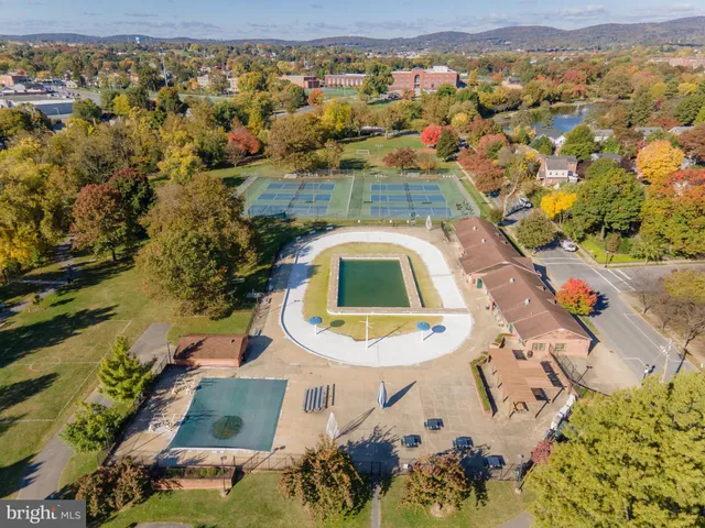 an aerial view of a house with a swimming pool