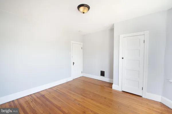 a view of a livingroom with wooden floor