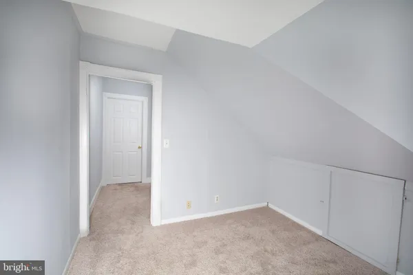 a view of an empty room and entryway